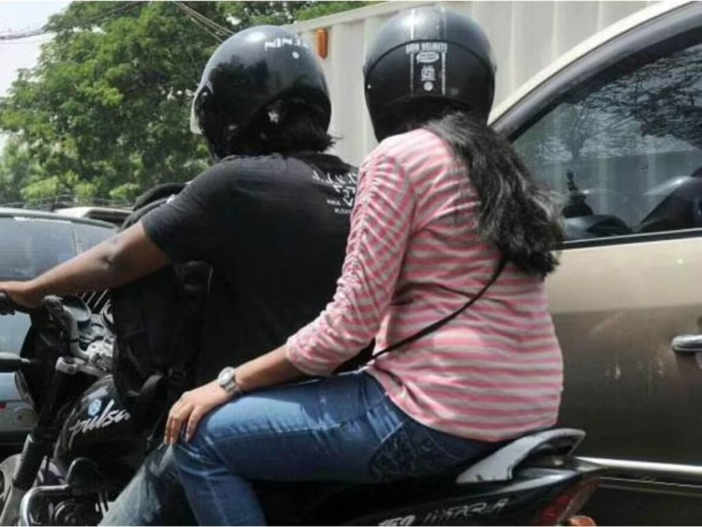 Rider and pillion with helmet
